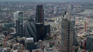 AX114_108 - 5.5K aerial stock footage of orbiting The Gherkin and Heron Tower skyscrapers, London, England