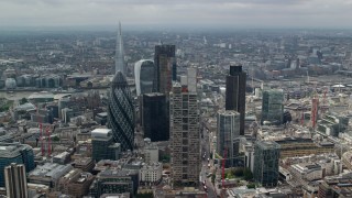 AX114_109 - 5.5K aerial stock footage orbiting group of skyscrapers, The Shard in the background, Central London, England