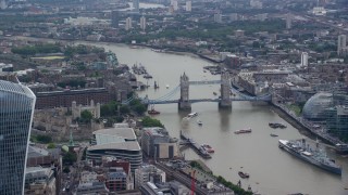 AX114_114 - 5.5K aerial stock footage of Tower of London, and Tower Bridge on River Thames, England