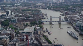 AX114_115E - 5.5K aerial stock footage of Tower of London, and iconic Tower Bridge on the River Thames, England