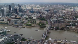 AX114_122E - 5.5K aerial stock footage wide view of Tower Bridge near Tower of London and Central London skyscrapers, England