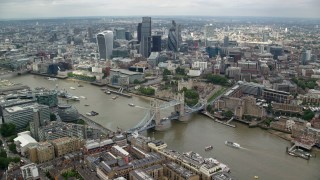 AX114_123 - 5.5K stock footage aerial video wide view of Tower Bridge near Tower of London and Central London skyscrapers, England
