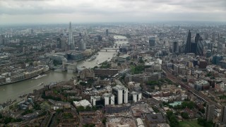 AX114_158 - 5.5K aerial stock footage approach The Shard and River Thames bridges in London, England