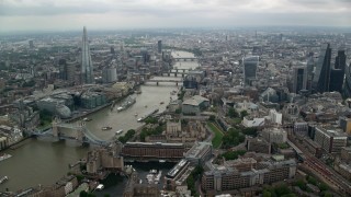 AX114_159 - 5.5K aerial stock footage of approaching bridges over the River Thames and The Shard skyscraper in London, England