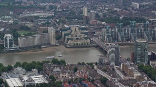 AX114_173E - 5.5K aerial stock footage of MI6 Building, and Vauxhall Bridge over River Thames, London, England