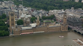 AX114_179 - 5.5K aerial stock footage of Big Ben, Parliament and Westminster Abbey across River Thames, London, England