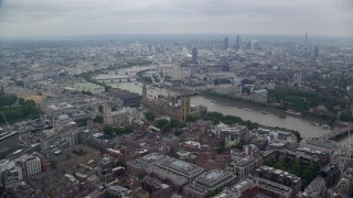 AX114_194E - 5.5K aerial stock footage fly over Big Ben and Westminster Bridge toward London Eye, England