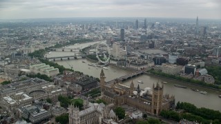 AX114_196 - 5.5K aerial stock footage fly over Big Ben, Parliament and Westminster Abbey toward London Eye, England
