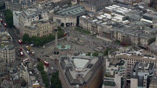 AX114_201 - 5.5K aerial stock footage of an orbit of Trafalgar Square, London, England
