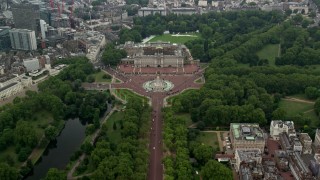 AX114_207 - 5.5K stock footage aerial video follow The Mall to approach Buckingham Palace, London, England