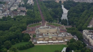 AX114_215E - 5.5K aerial stock footage of flying by the back of Buckingham Palace, London, England