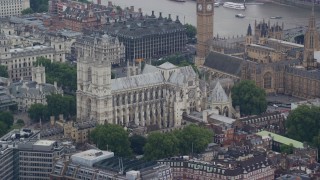 AX114_218E - 5.5K aerial stock footage of orbiting Westminster Abbey, London, England