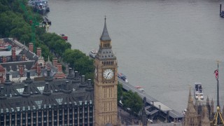 AX114_224 - 5.5K aerial stock footage of Big Ben, reveal British flag, London, England