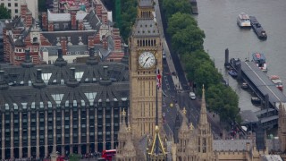 AX114_225 - 5.5K aerial stock footage flyby Big Ben and the British flag, London, England
