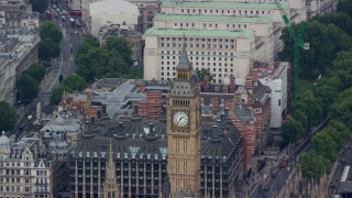 AX114_226E - 5.5K aerial stock footage of orbiting Big Ben revealing HM Treasury, London, England