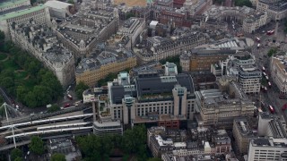 AX114_231E - 5.5K aerial stock footage of Charing Cross Railway Station and Hungerford Bridge, London, England