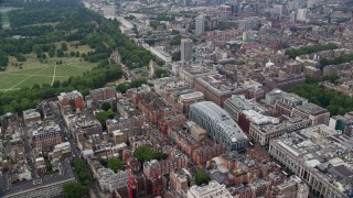 AX114_245E - 5.5K aerial stock footage fly over office buildings and city streets, London, England