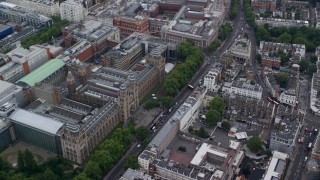 AX114_260E - 5.5K aerial stock footage of an orbit of the Natural History Museum, London, England