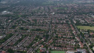 AX114_278E - 5.5K aerial stock footage of residential neighborhoods near Brent Valley Golf Club, London, England