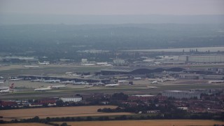 AX114_283 - 5.5K aerial stock footage of London Heathrow Airport, England