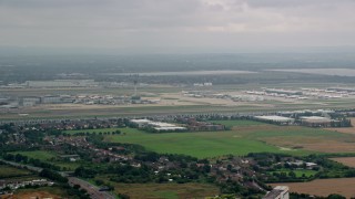 AX114_289 - 5.5K aerial stock footage approach jet on the runway at London Heathrow Airport, England
