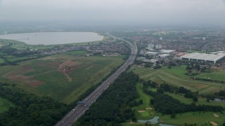 AX114_295E - 5.5K aerial stock footage fly over residential neighborhoods by M4 Freeway, Slough, England