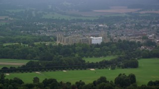 AX114_302 - 5.5K aerial stock footage of Windsor Castle surrounded by green trees, England