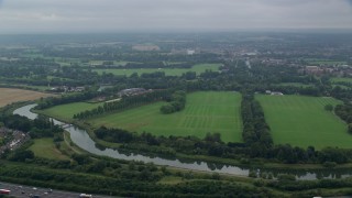 AX114_304 - 5.5K aerial stock footage of flying over the Thames toward Windsor Castle, England