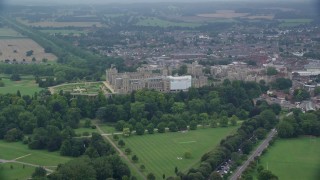 AX114_306E - 5.5K aerial stock footage of flying by historic Windsor Castle and East Terrace Lawn, England