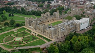 AX114_308 - 5.5K stock footage aerial video of orbiting Windsor Castle and East Terrace Lawn, England