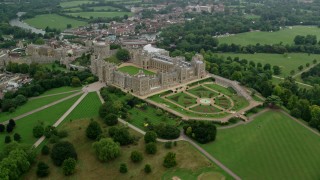 AX114_310 - 5.5K stock footage aerial video of orbiting historic Windsor Castle and the East Terrace Lawn, England