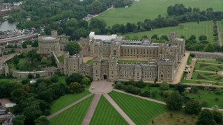 AX114_311 - 5.5K stock footage aerial video of orbiting the side of iconic Windsor Castle, England