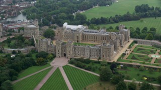 AX114_311E - 5.5K aerial stock footage orbit historic Windsor Castle revealing St George's Chapel, England