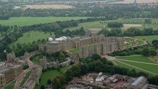 AX114_313 - 5.5K aerial stock footage orbit historic Windsor Castle revealing St George's Chapel, England