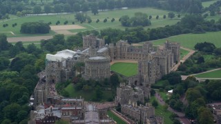 AX114_315E - 5.5K aerial stock footage of an orbit around iconic Windsor Castle, England
