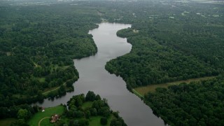 AX114_344 - 5.5K aerial stock footage fly over Virginia Water Lake and trees, England