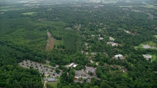 AX114_347 - 5.5K aerial stock footage fly over homes in the small town of Virginia Water, England