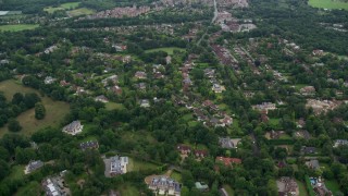 AX114_348 - 5.5K aerial stock footage fly over upscale homes and trees, Virginia Water, England