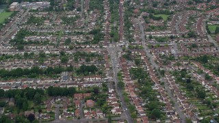AX114_357 - 5.5K aerial stock footage of orbiting residential neighborhoods, Addlestone, England