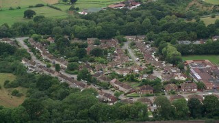 AX114_381 - 5.5K aerial stock footage of flying over residential community, Redhill, England