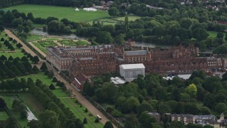 AX115_023E - 5.5K aerial stock footage of orbiting historic Hampton Court Palace, Molesey, England