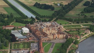 AX115_026E - 5.5K aerial stock footage of circling around Hampton Court Palace, Molesey, England