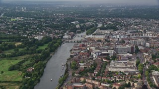 AX115_032E - 5.5K aerial stock footage of bridges over River Thames and city buildings, Kingston Upon Thames, England