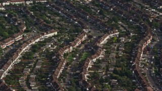 AX115_042 - 5.5K aerial stock footage of rows of homes in a residential neighborhood, Morden, England
