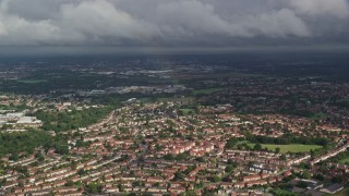 AX115_043 - 5.5K aerial stock footage of a rainbow over residential neighborhood, Morden, England