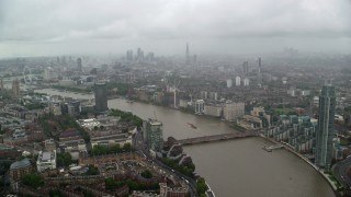 AX115_084 - 5.5K aerial stock footage of the River Thames winding through the city, London, England