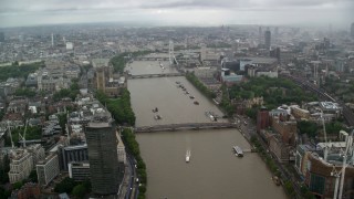 AX115_086 - 5.5K aerial stock footage approach Lambeth Bridge, Big Ben and Parliament in the rain, London, England