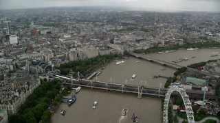 AX115_089 - 5.5K aerial stock footage of Hungerford Bridge over the River Thames, fly towards Somerset House, England