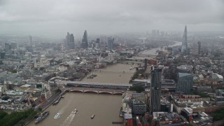 AX115_090E - 5.5K aerial stock footage of Blackfriars Bridge over River Thames and Central London England