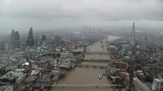AX115_092 - 5.5K aerial stock footage follow the River Thames through Central London, England